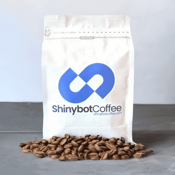 Single bag of coffee with coffee beans around it